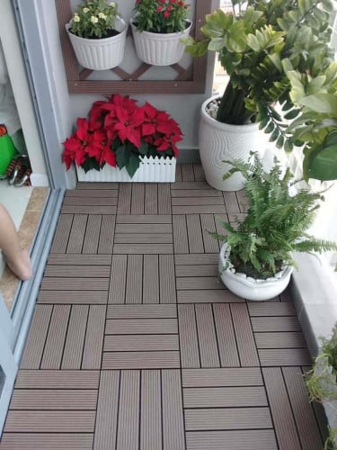 Wood plastic composite tile flooring