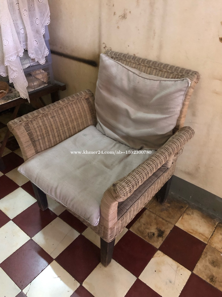 Rattan chair + pillows in Phnom Penh, Cambodia on
