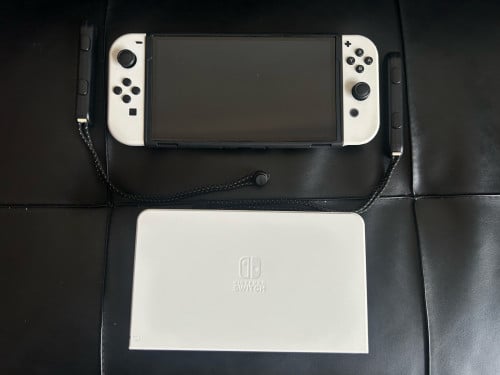 Nintendo Switch OLED សេរីថ្មីអេក្រង់ច្បាស់ល្អមិនសូវមានពេលលេងចង់លក់វិញ
