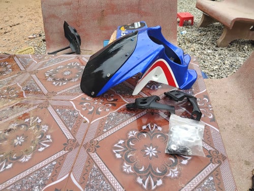 Honda cb400sf headlight shroud with brackets.  New