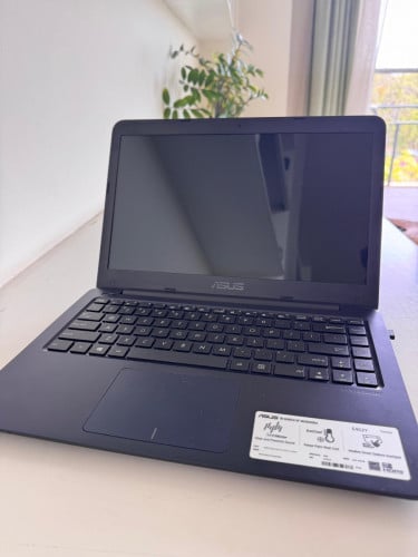ASUS Laptop with mouse and charger