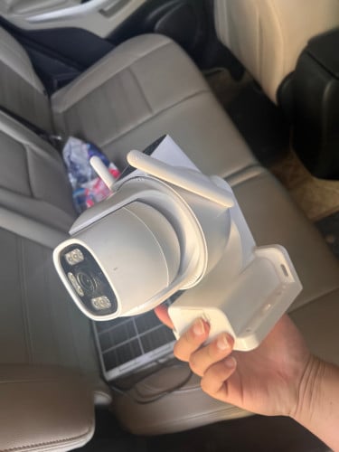 Dual head solar security camera