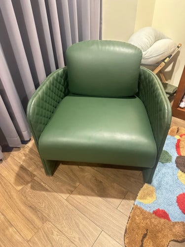Green leather single sofa chair