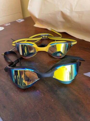Swimming goggles and Caps