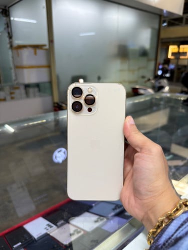 iPhone 13 Pro Max Gold LL/A HD128G Phone Condition 95% 🔋ដូរ82% , អេក្រង់GX , អត់ស្កេនមុខ បែកខ្នង