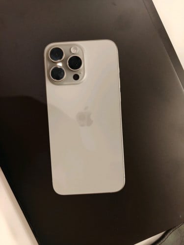 Sell Iphone 15 pro max, natural titanium, look like new 99 %, never repair or change part. E sim