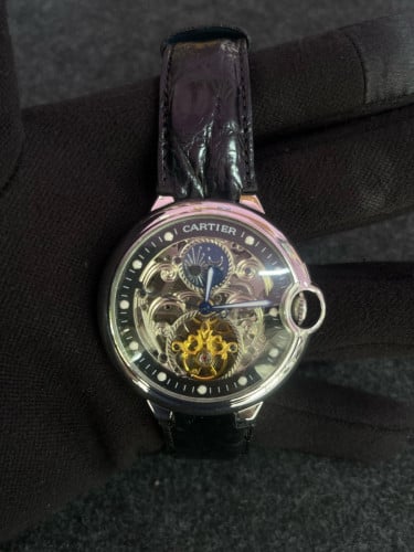 Cartier mechanical watch with a black leather strap