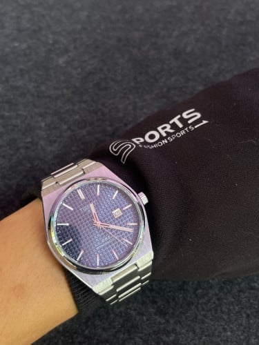 Tissot PRX Powermatic 80 watch with a navy blue waffle dial and stainless steel integrated bracelet.