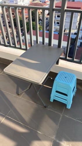 Metal table and four stools for outdoor
