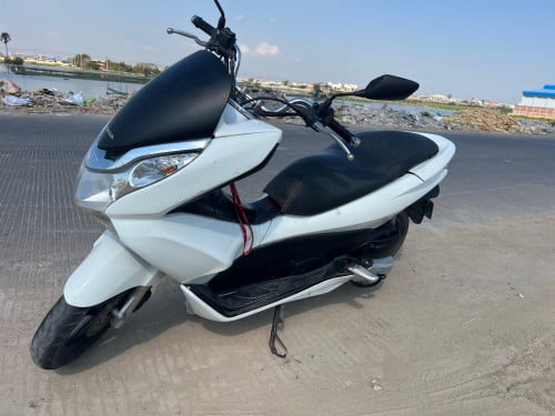 ម៉ូតូស្អាតអាវមូល