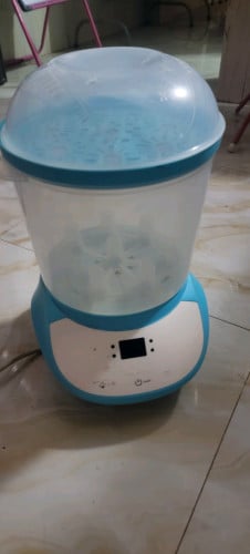 ម៉ាស៊ីនចំហុយដបទឹកដោះគោ