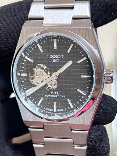 Tissot Automatic PRX Powermatic 80 with a black "Open Heart" dial