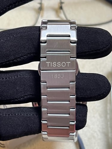 Tissot Automatic PRX Powermatic 80 with a black "Open Heart" dial