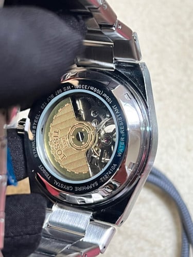 Tissot Automatic PRX Powermatic 80 with a black "Open Heart" dial