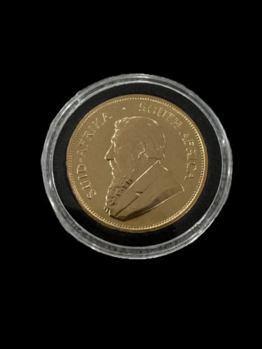 កាក់មាស Krugerrand អាហ្វ្រិកខាងត្បូង ក្រុមហ៊ុនផលិត៖ រោងចក្រចម្រាញ់ Rand ភាពបរិសុទ្ធ៖ ៩១.៦%