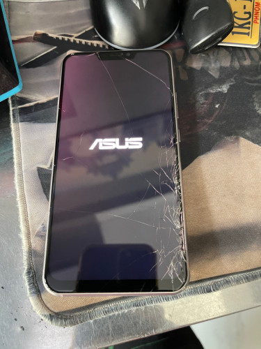 ASUS Zenfone 5 (បែកអេក្រង់មុខ និងខ្នងក្រោយ ហើយសាកថ្មីមិនចូល)