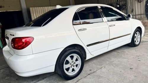 Corolla 03 ឡានកាលីក្នុងលឿងធានាឡានស្អាតអត់ដូរពណ៌អត់កាត់តឡានស្អាត អត់បុក