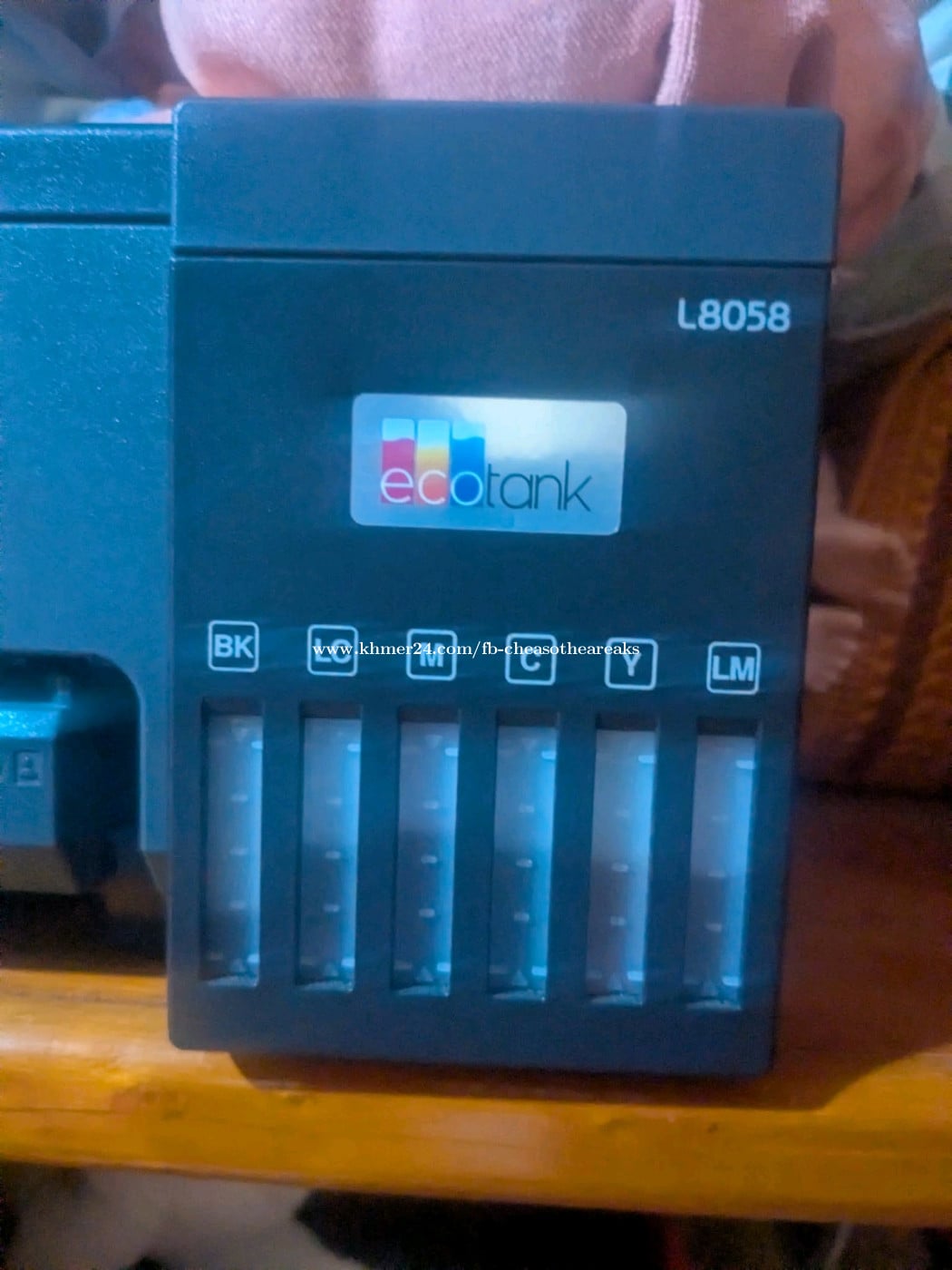 Epson EcoTank L8058 photo printer featuring a 6-color ink system.