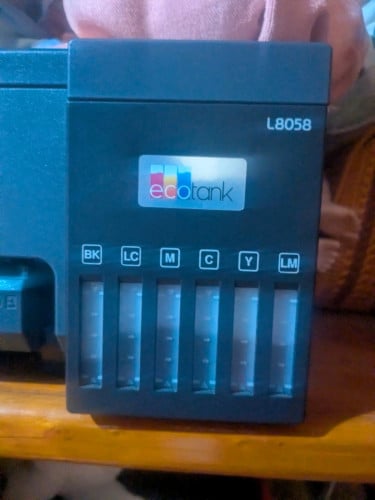 Epson EcoTank L8058 photo printer featuring a 6-color ink system.