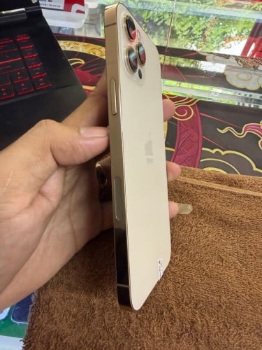 iPhone 12 ProMax 128G color Gold ថ្ម100% ឡុកអុីសុីម (ប្រើបានសុីម2)