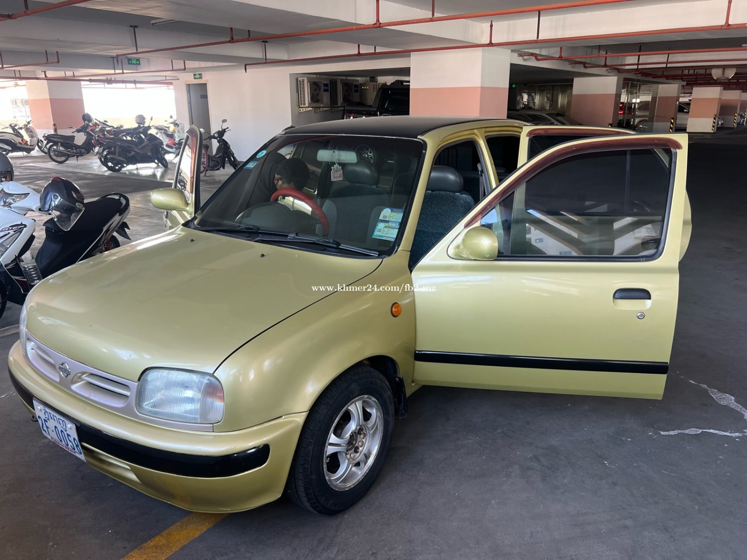 Nissan March year 1998 Location Phnom Penh.