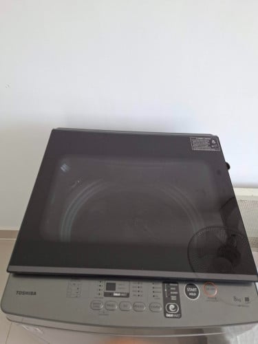 Used Toshiba 8kg top load washing machine, free stand & cover