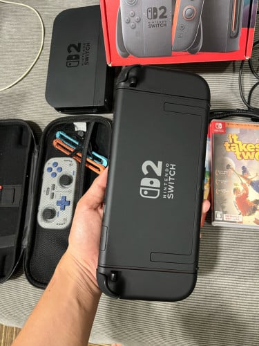 Nintendo Switch 2 + Case + 3 Games + additional INE controller